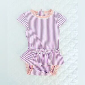 RuffleButts Peplum Skirt Flutter Sleeve Rash Guard Swimsuit in Lilac Seersucker